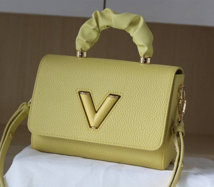 Louis Vuitton Taurillon Leather Twist MM Scrunchie Handle In Ginger Yellow angle 2
