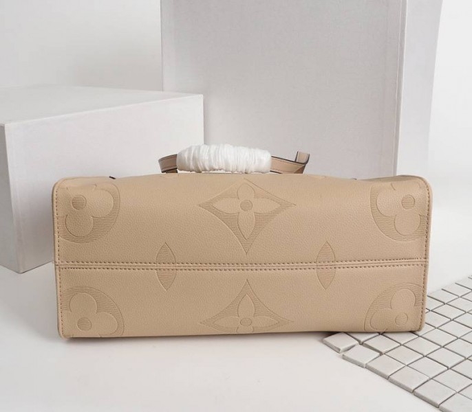 Louis Vuitton Monogram Empreinte Giant Onthego MM Bag In Beige angle 4