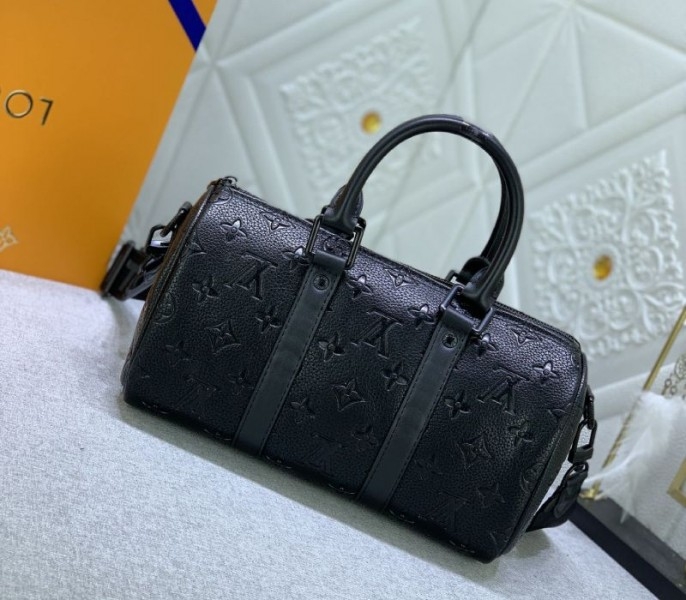 Louis Vuitton Taurillon Monogram Leather Keepall Bandouliere 25 In Black angle 3