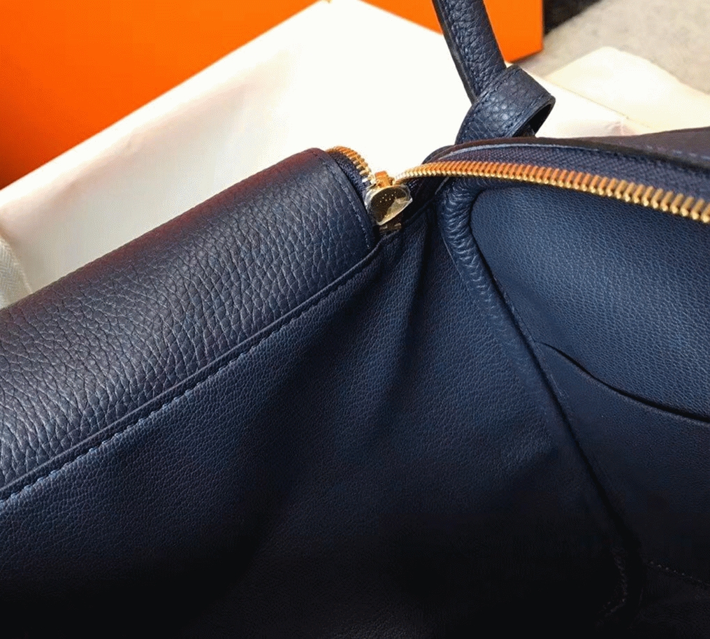 Fake designer Hermes Lindy 26cm handbag in navy blue angle 4