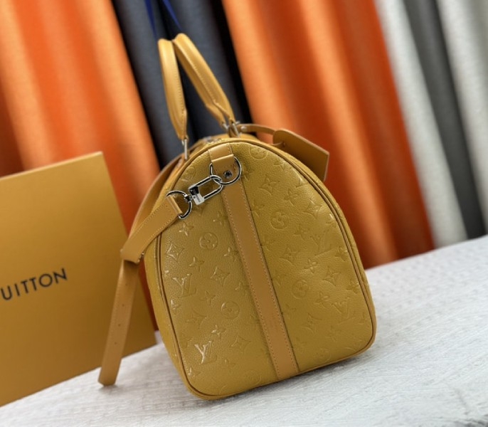 Louis Vuitton Taurillon Leather Keepall Bandouliere 50 In Safran Yellow angle 4