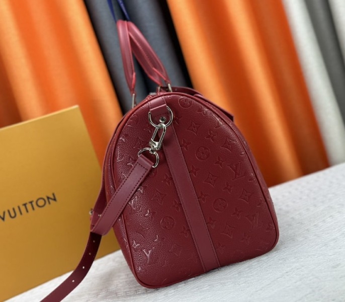 Louis Vuitton Taurillon Leather Keepall Bandouliere 50 In Sari Red angle 4