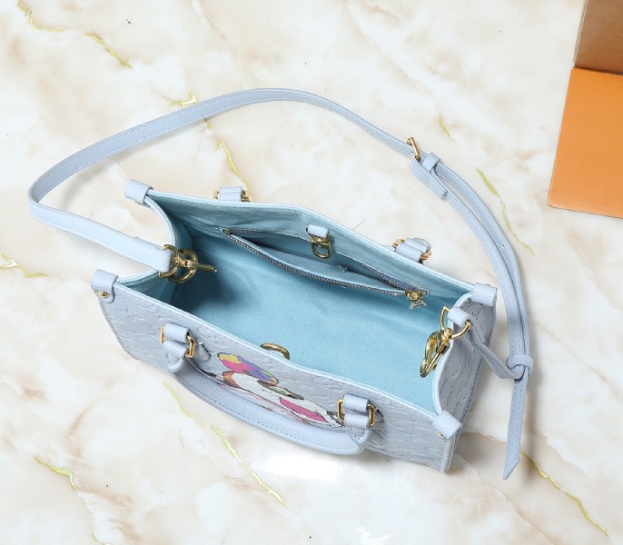 X TM Monogram Empreinte OnTheGo PM With Bijou Edition In Washed Blue angle 3