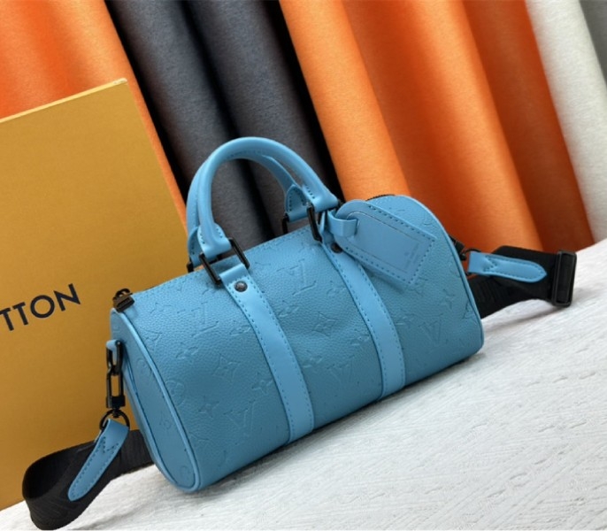 Louis Vuitton Taurillon Monogram Leather Keepall Bandouliere 25 In Turquoise angle 2