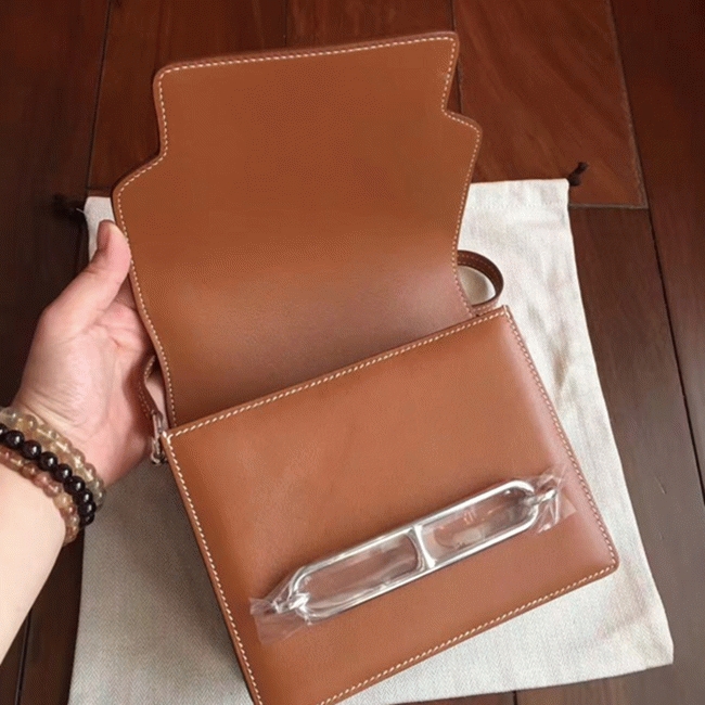 Caramel replica Hermes Mini Sac Roulis handbag angle 4