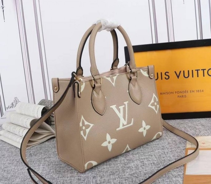 Louis Vuitton Bicolor Monogram Empreinte Leather Onthego PM Bag In Tourterelle Gray And Cream angle 2