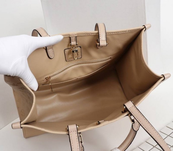 Louis Vuitton Monogram Empreinte Giant Onthego MM Bag In Beige angle 5