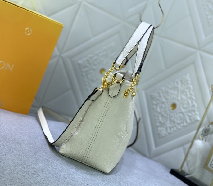 Louis Vuitton Monogram Empreinte Leather Bundle Bag In Cream angle 3