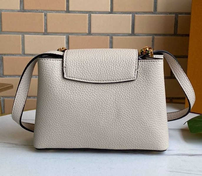 Louis Vuitton Capucines Mini Chain Bag In Beige angle 4