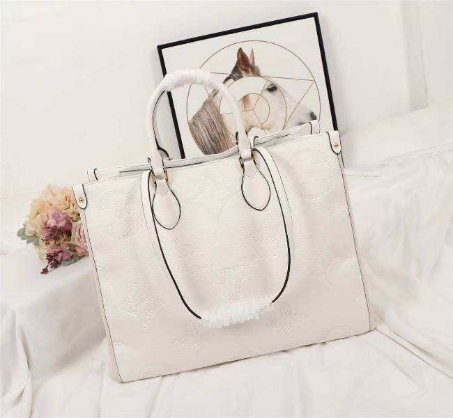 Louis Vuitton Monogram Empreinte Giant Onthego GM Tote In Cream angle 2