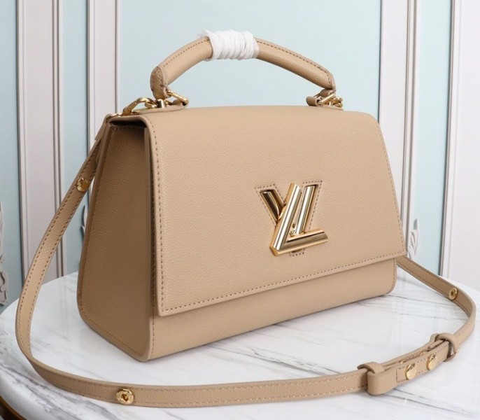Louis Vuitton Twist One Handle MM Handbag In Beige angle 2