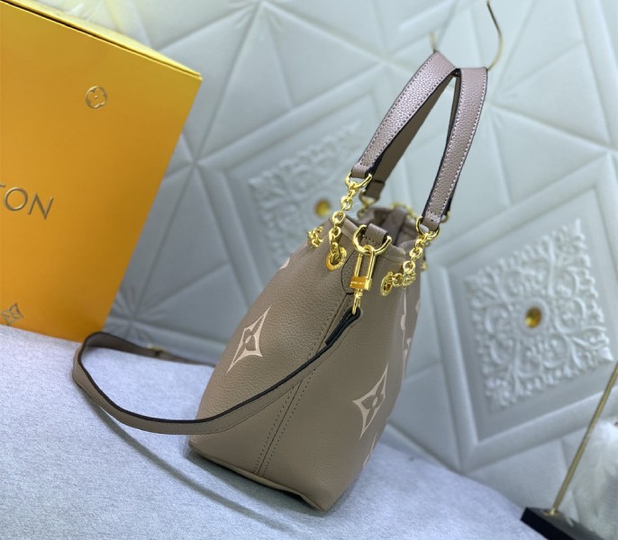 Louis Vuitton Bicolor Monogram Empreinte Bundle Bag In Tourterelle Gray and Cream angle 4