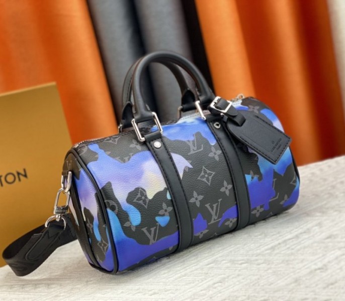 Louis Vuitton Monogram Eclipse Keepall Bandouliere 25 Travel Bag In Blue And Purple Sunrise angle 2