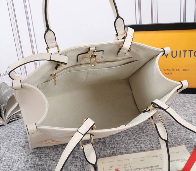 Louis Vuitton Monogram Empreinte Leather Onthego MM Bag In Cream Saffron angle 5