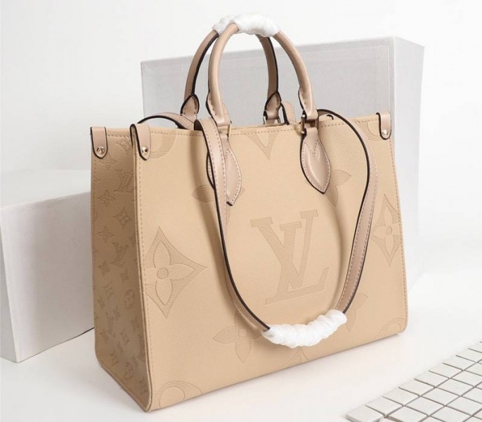 Louis Vuitton Monogram Empreinte Giant Onthego MM Bag In Beige angle 2