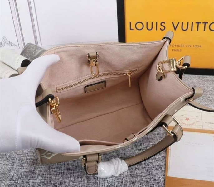 Louis Vuitton Bicolor Monogram Empreinte Leather Onthego PM Bag In Tourterelle Gray And Cream angle 5
