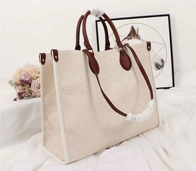 Louis Vuitton Monogram Empreinte Onthego GM Tote In Cream angle 2