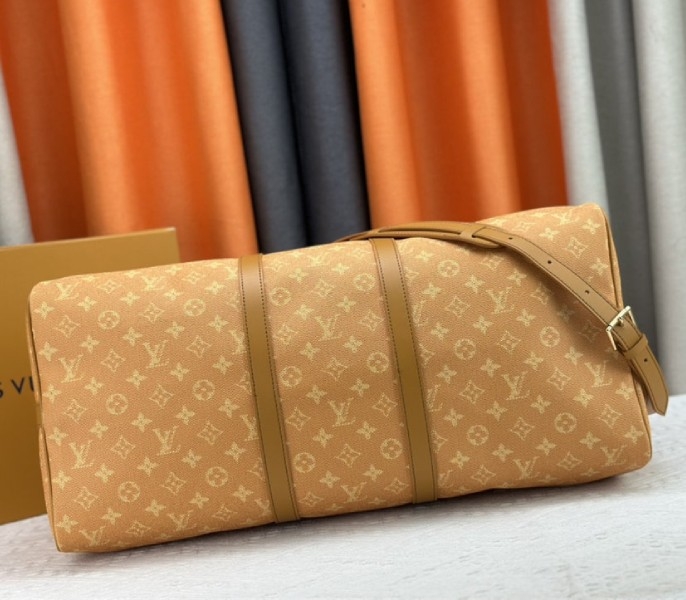 Louis Vuitton Monogram Heritage Canvas Keepall Bandouliere 55 In Yellow angle 5