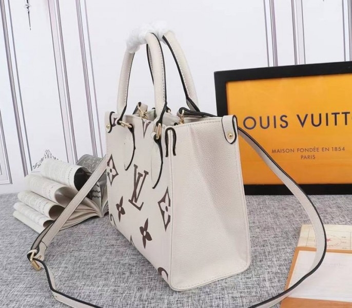 Louis Vuitton Bicolor Monogram Empreinte Leather Onthego PM Bag In Cream And Bois De Rose Pink angle 3
