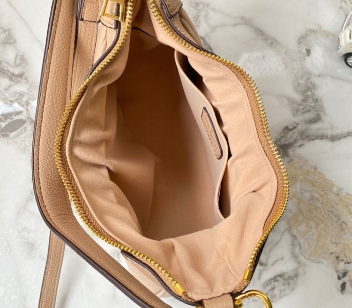 Louis Vuitton Monogram Empreinte Leather Bagatelle Mini Hobo In Beige angle 5