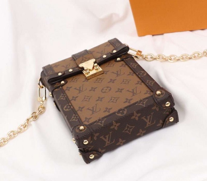 Louis Vuitton Monogram Reverse Canvas Vertical Trunk Pochette angle 4