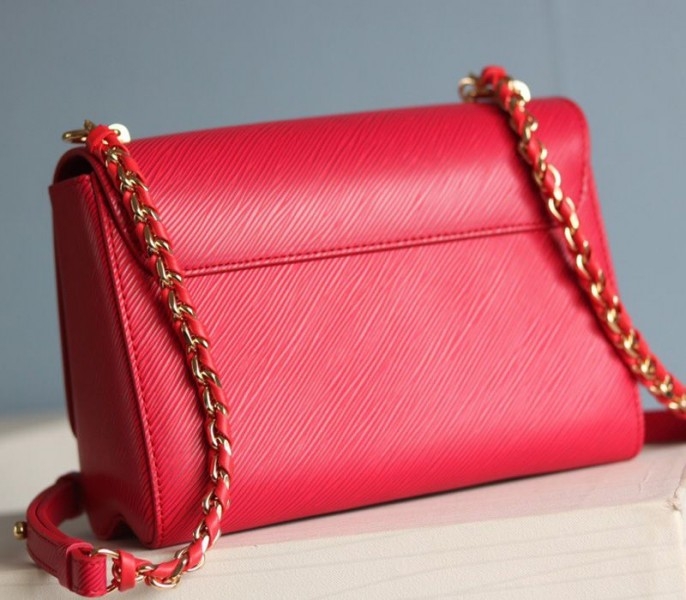 Louis Vuitton Epi Leather Twist MM Bag In Red angle 4