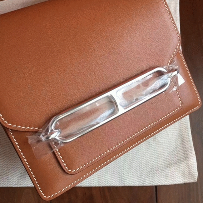 Caramel replica Hermes Mini Sac Roulis handbag angle 3