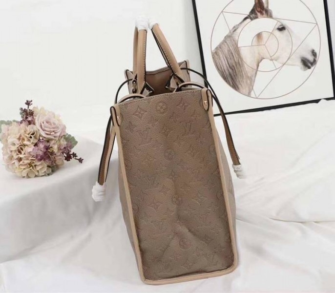 Louis Vuitton Monogram Empreinte Giant Onthego GM Tote In Beige angle 3