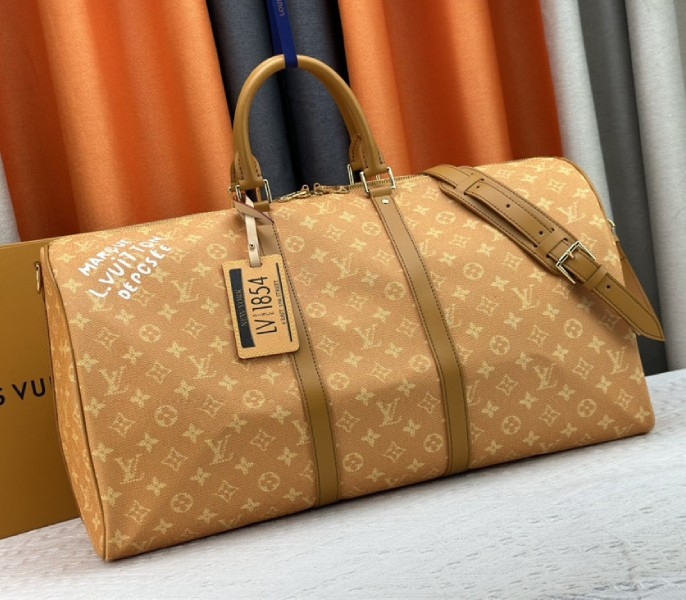 Louis Vuitton Monogram Heritage Canvas Keepall Bandouliere 55 In Yellow angle 2