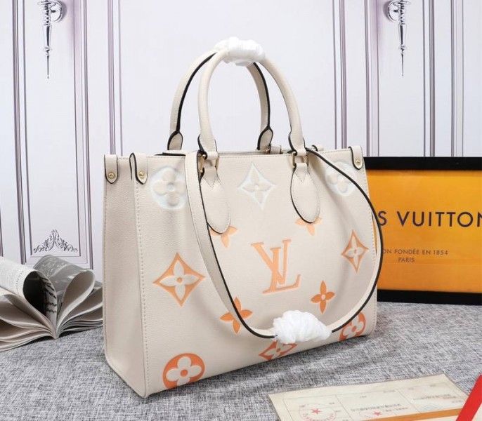 Louis Vuitton Monogram Empreinte Leather Onthego MM Bag In Cream Saffron angle 2