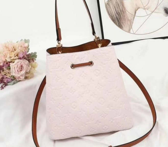 Louis Vuitton Monogram Empreinte NeoNoe MM Bag In Cream angle 3