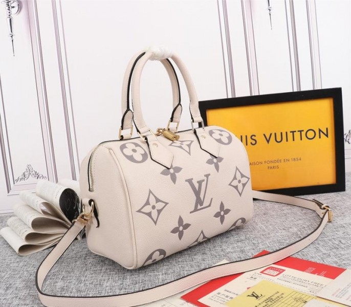 Louis Vuitton Bicolor Monogram Empreinte Leather Speedy Bandouliere 25 Handbag In Cream And Bois De Rose Pink angle 2