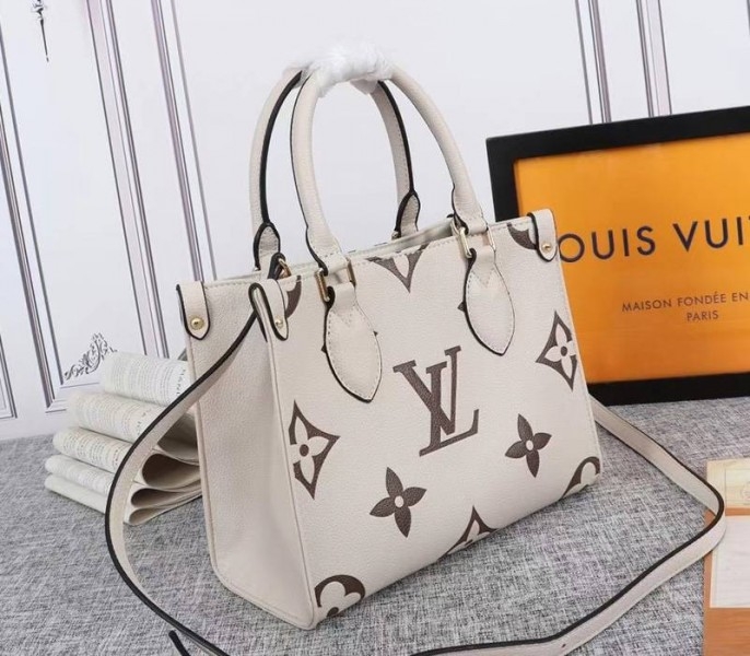 Louis Vuitton Bicolor Monogram Empreinte Leather Onthego PM Bag In Cream And Bois De Rose Pink angle 2