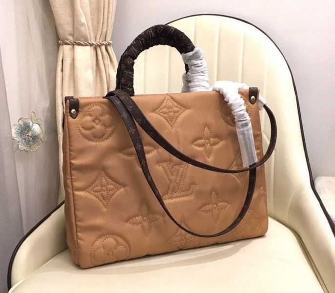 Louis Vuitton Econyl Regenerated Nylon Onthego GM Tote In Beige angle 3