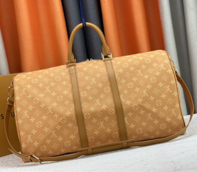 Louis Vuitton Monogram Heritage Canvas Keepall Bandouliere 55 In Yellow angle 4
