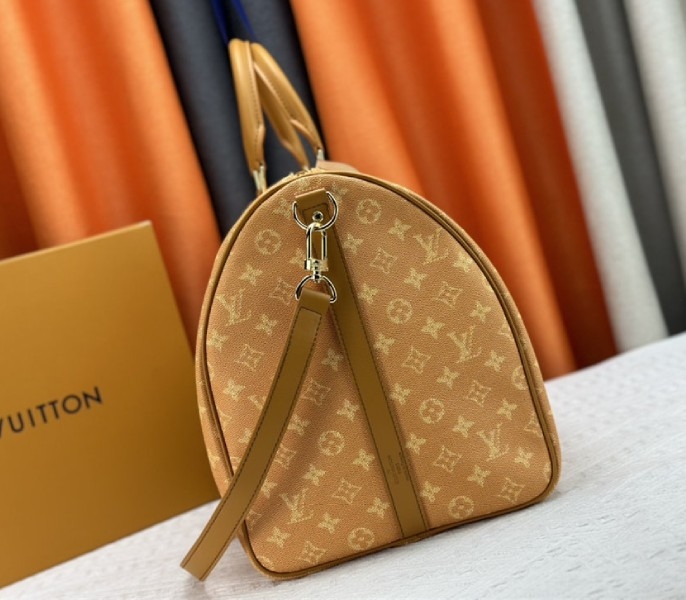 Louis Vuitton Monogram Heritage Canvas Keepall Bandouliere 55 In Yellow angle 3