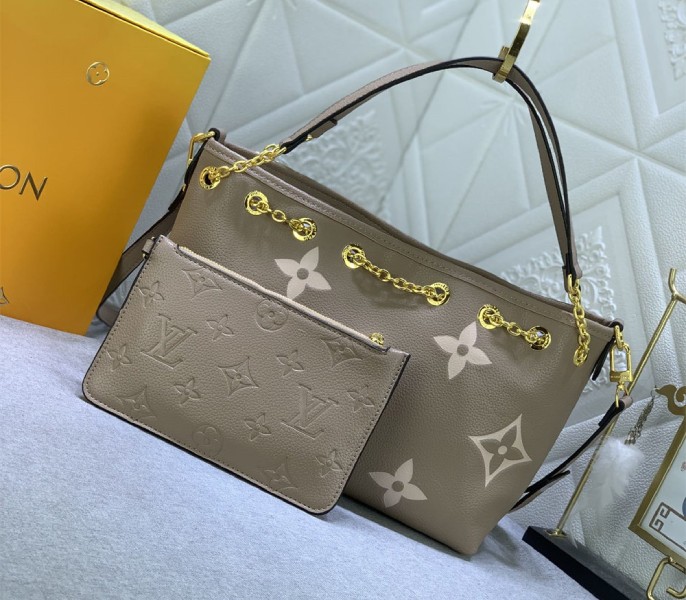 Louis Vuitton Bicolor Monogram Empreinte Bundle Bag In Tourterelle Gray and Cream angle 2