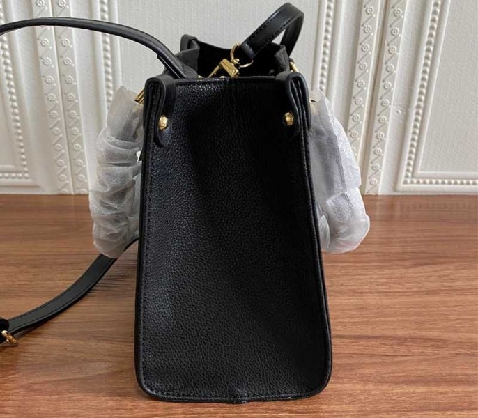Louis Vuitton Monogram Empreinte Leather Onthego PM Bag In Black angle 4