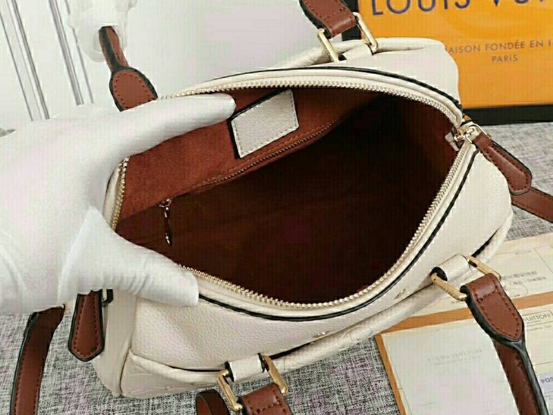 Louis Vuitton Monogram Empreinte Speedy Bandouliere 25 Handbag In Cream angle 5