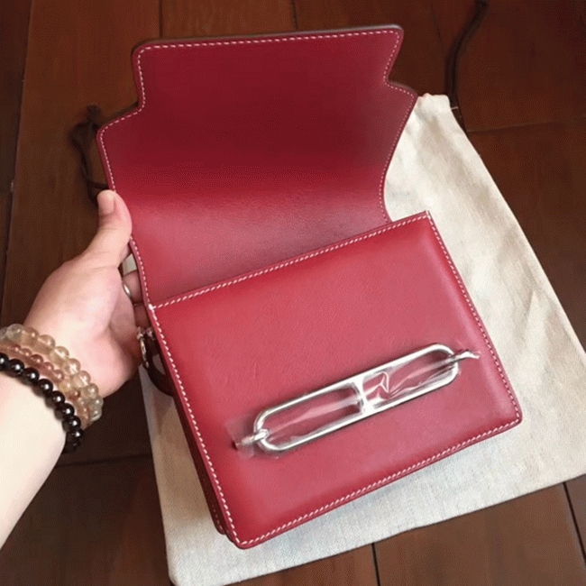 Red designer replica Hermes Mini Sac Roulis handbag angle 4
