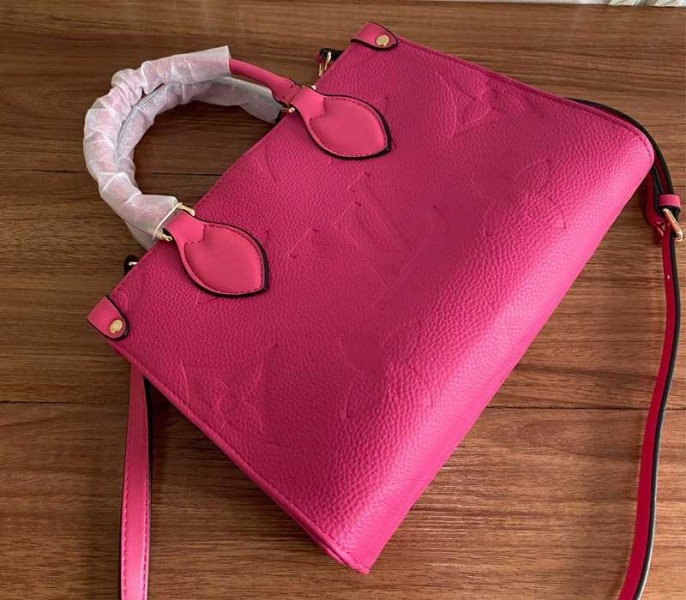 Louis Vuitton Monogram Empreinte Leather Onthego PM Bag In Freesia Pink angle 4