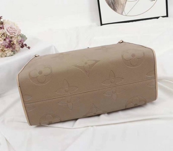Louis Vuitton Monogram Empreinte Giant Onthego GM Tote In Beige angle 4