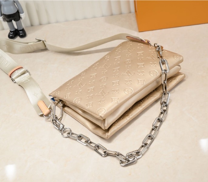 Louis Vuitton Coussin PM Bag In Light Gold With Jacquard Strap angle 4