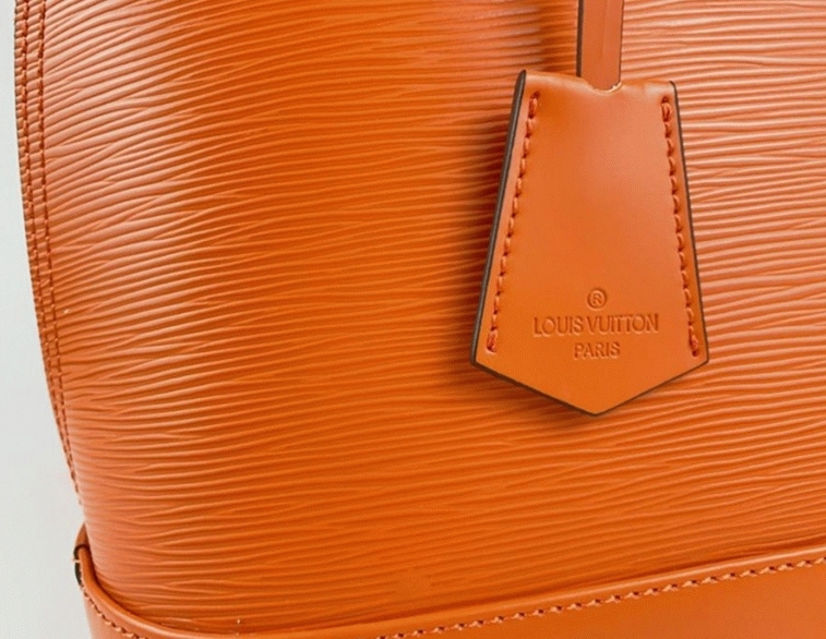 Louis Vuitton Epi Leather Alma PM Handbag In Orange With Jacquard Strap angle 2