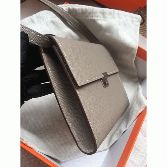 Grey 1:1 replica Hermes Clic wallet with strap angle 2