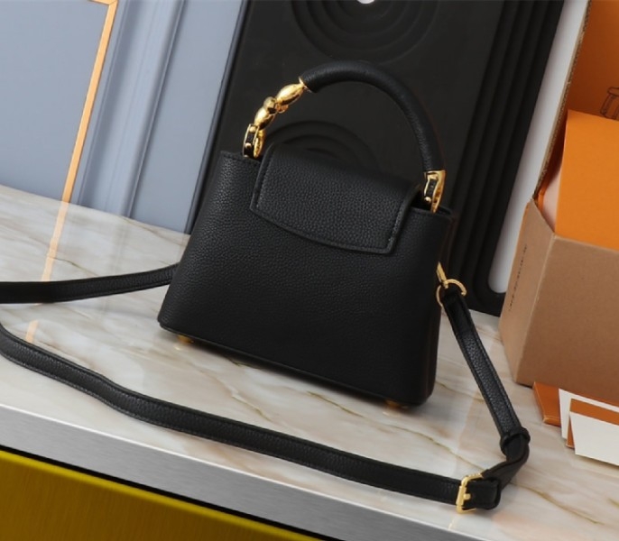 Louis Vuitton Capucines Mini Capucines Handbag In Black angle 2