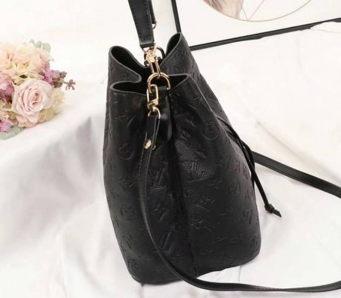 Louis Vuitton Monogram Empreinte NeoNoe MM Bag In Black angle 4
