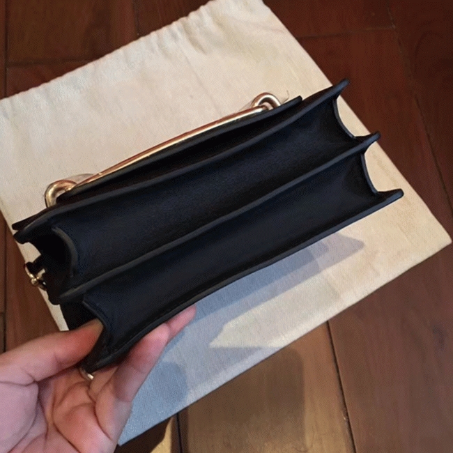 Black knockoff Hermes Mini Sac Roulis handbag angle 4