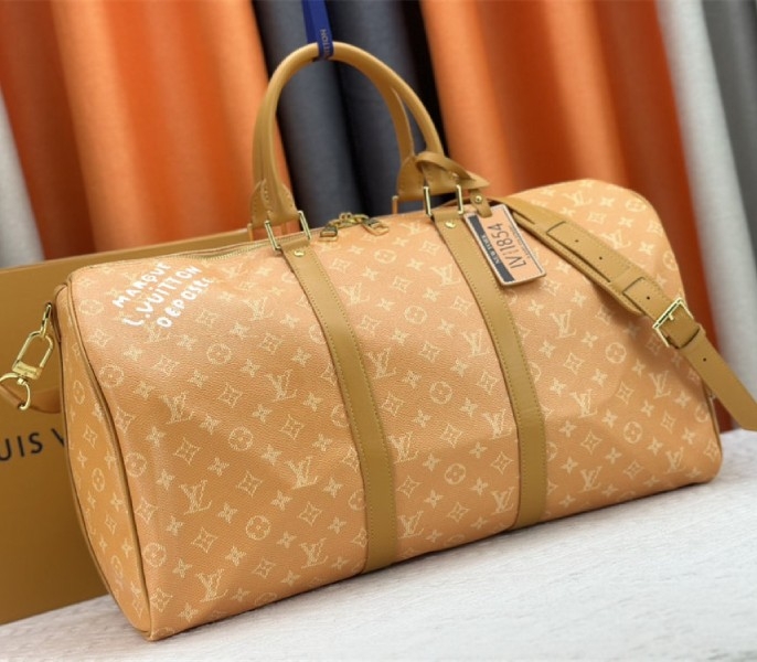 Louis Vuitton Monogram Heritage Canvas Keepall Bandouliere 50 In Yellow angle 2