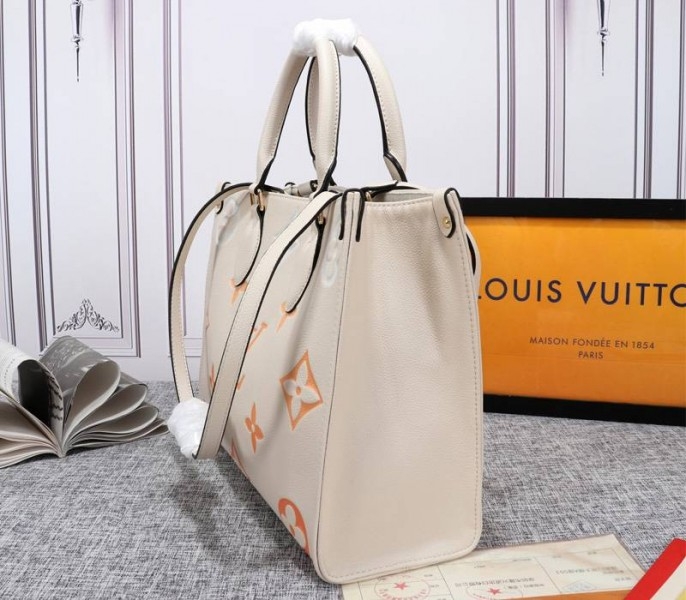 Louis Vuitton Monogram Empreinte Leather Onthego MM Bag In Cream Saffron angle 3